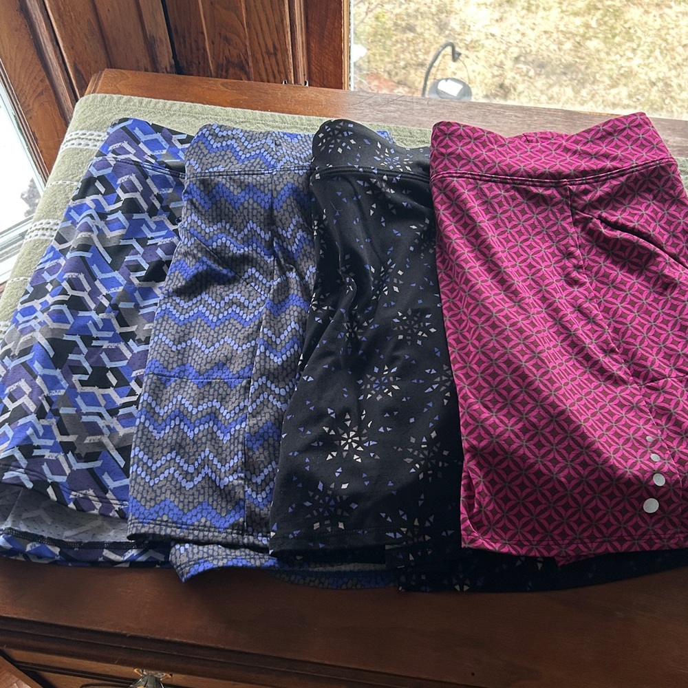 L.L. Bean WMN Skorts (4). Beautiful patterns. Each has 1 sided zippered pocket.
